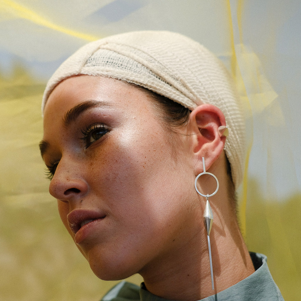 Model wearing Anja Berg - Silver Closed Bell Designer Earrings on IndieFaves
