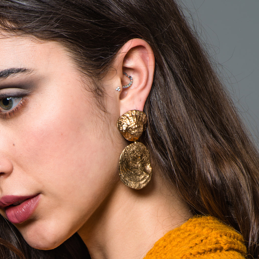 Model wearing Bronze Shell Dangle Designer Earrings on IndieFaves