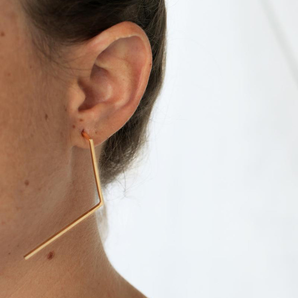  Model wearing Tami Eshed - V-Shaped Black Designer Earrings on IndieFaves