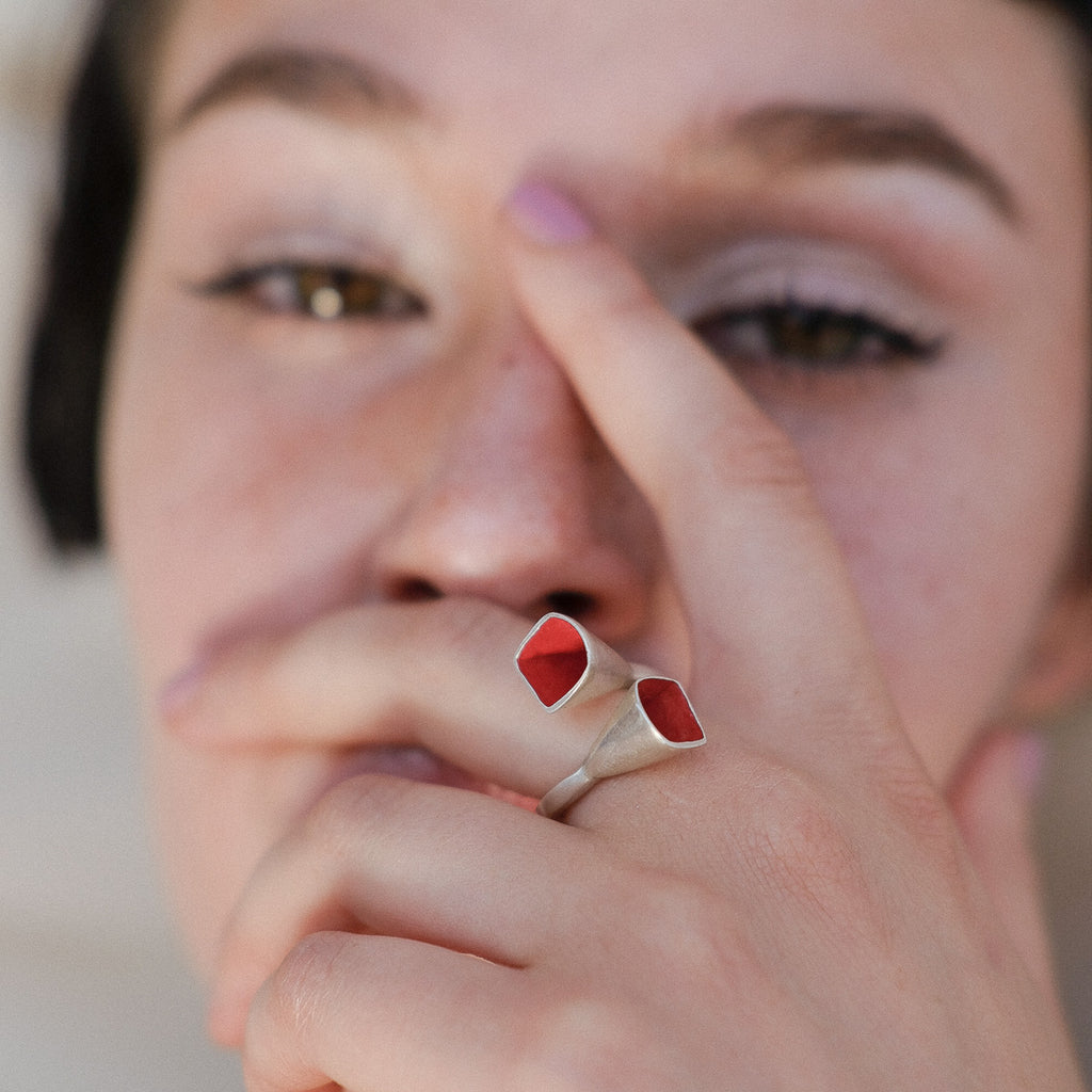 Model wearing Anja Berg - Silver and Red Enamel Interlaced Bells Designer Ring on IndieFaves