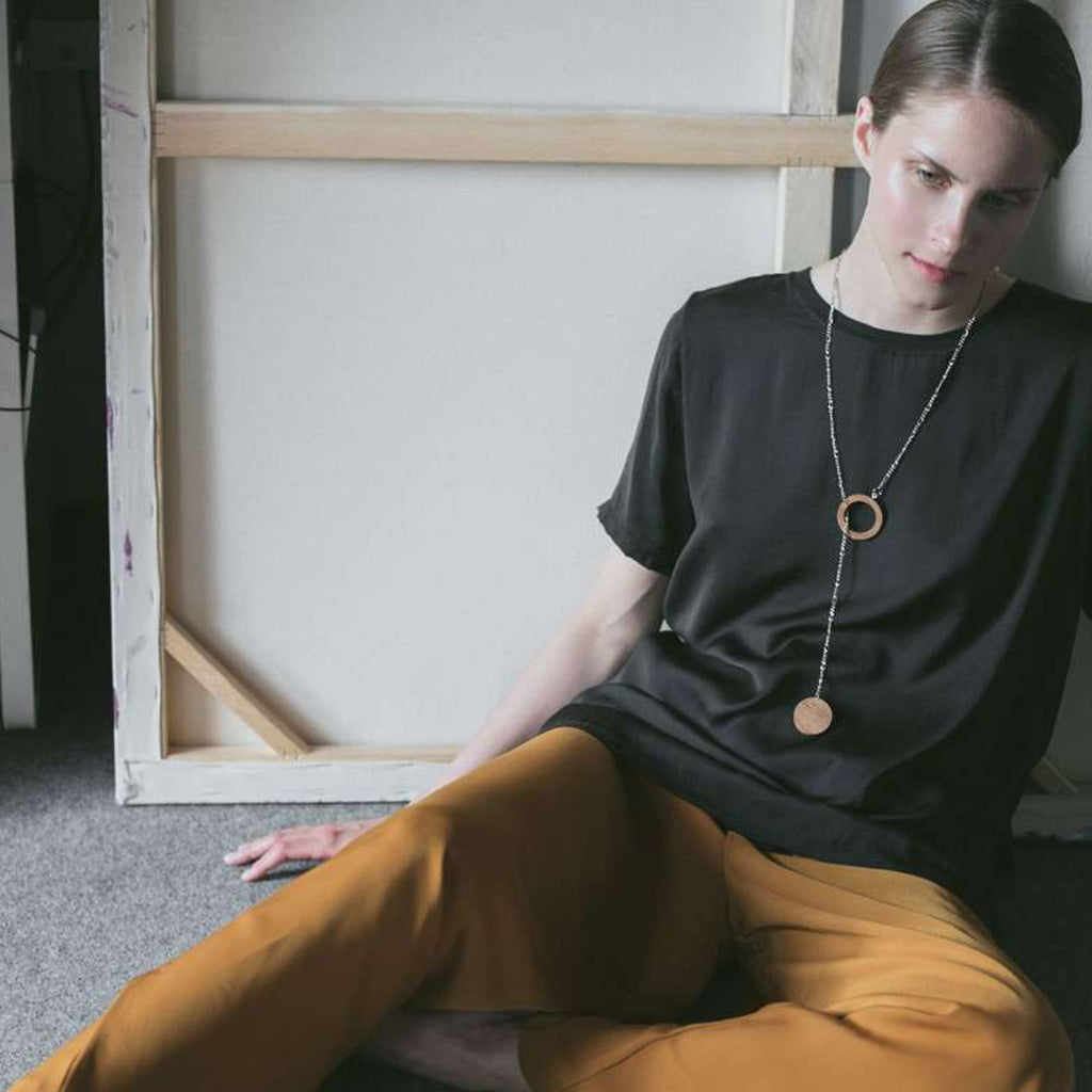 Model wearing Sustainable BirchWood Wooden Deform Designer Necklace with Chain on IndieFaves