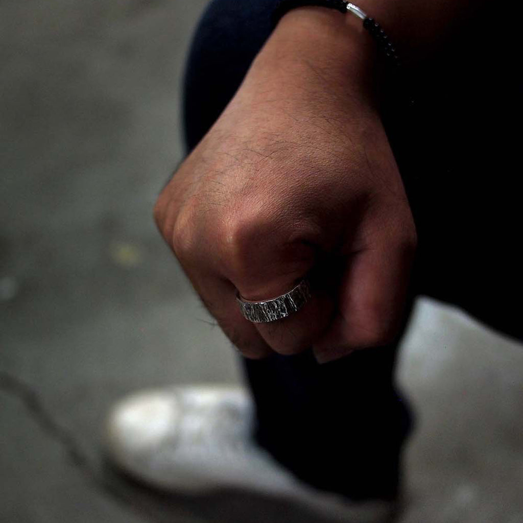 Model wearing Men’s Oxidized Sterling Silver Husk 8 Designer Ring on IndieFaves