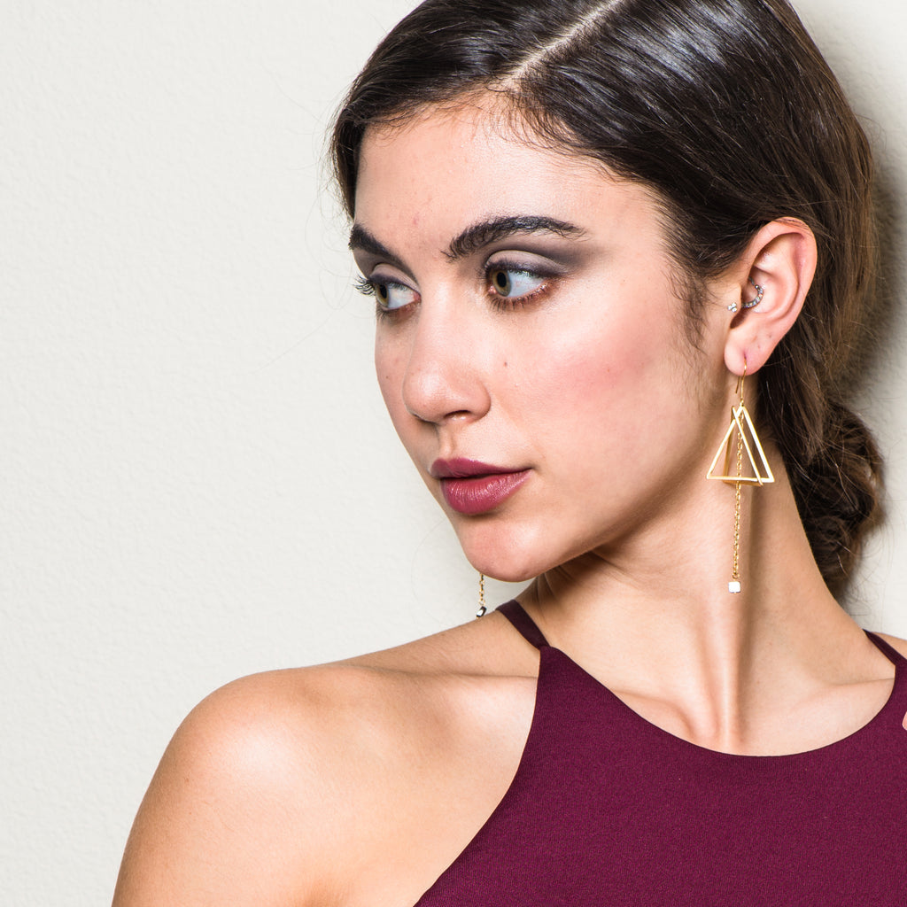 Model wearing 18K Gold-Plated and Garnet Double Triangle Dangle Designer Earrings on IndieFaves