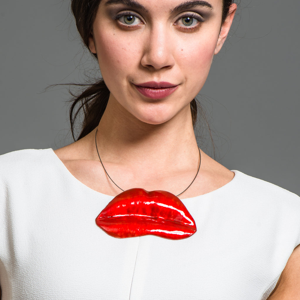 Model wearing Red Enamel Bronze Lips Designer Necklace on IndieFaves