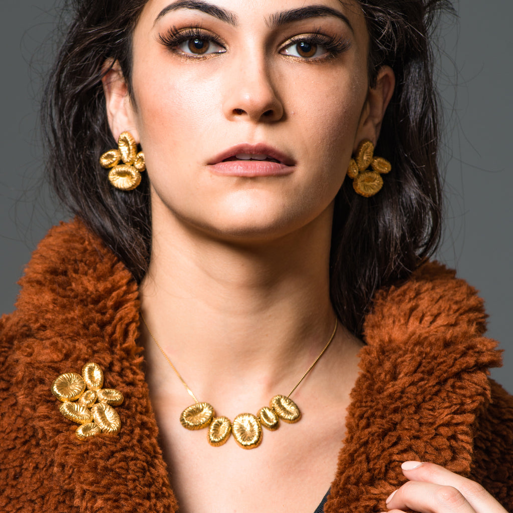 Model wearing 18K Gold-Plated Silver Omega Stud Designer Earrings on IndieFaves
