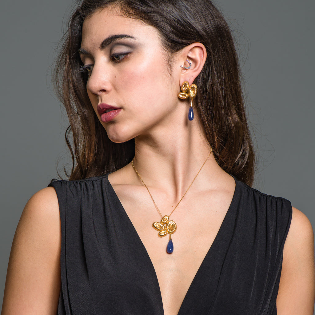 Model wearing 18K Gold-Plated Silver Dangle Designer Earrings with Tanzanite Drops on IndieFaves
