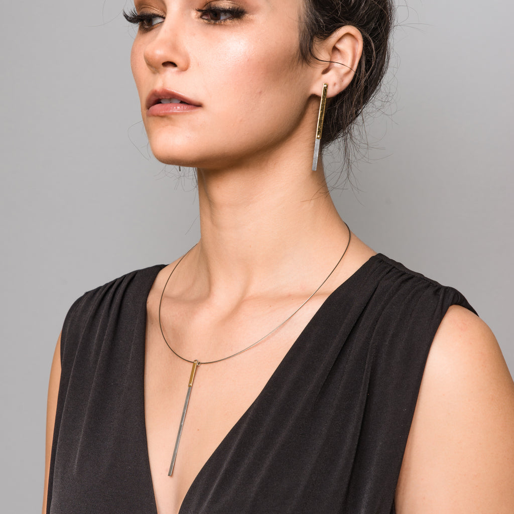 Model wearing Upcycled Steel and Gold-Coated Dangle Designer Earrings on IndieFaves