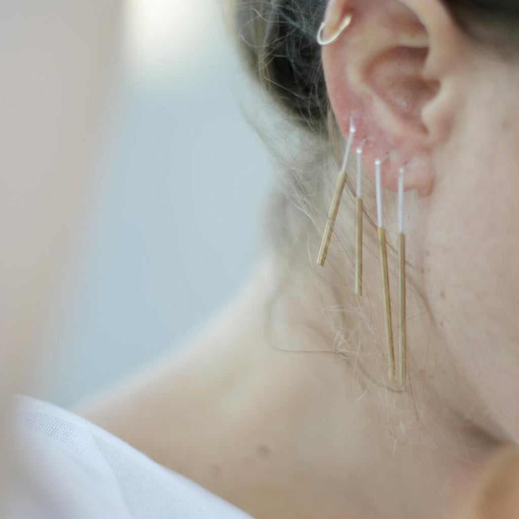 Model wearing Tami Eshed - Double Line Gold and Silver Designer Earrings on IndieFaves