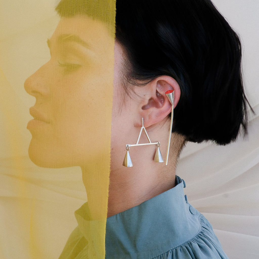 Model wearing Anja Berg - Silver and Red Enamel Red Line Designer Earrings on IndieFaves